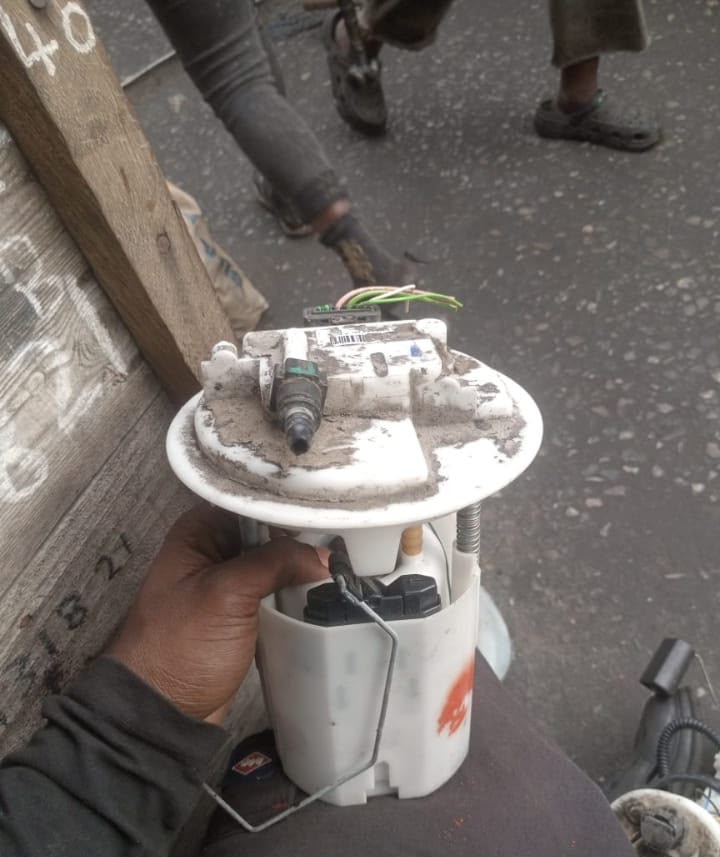 Reconditioned fuel pump module held for fitment inspection